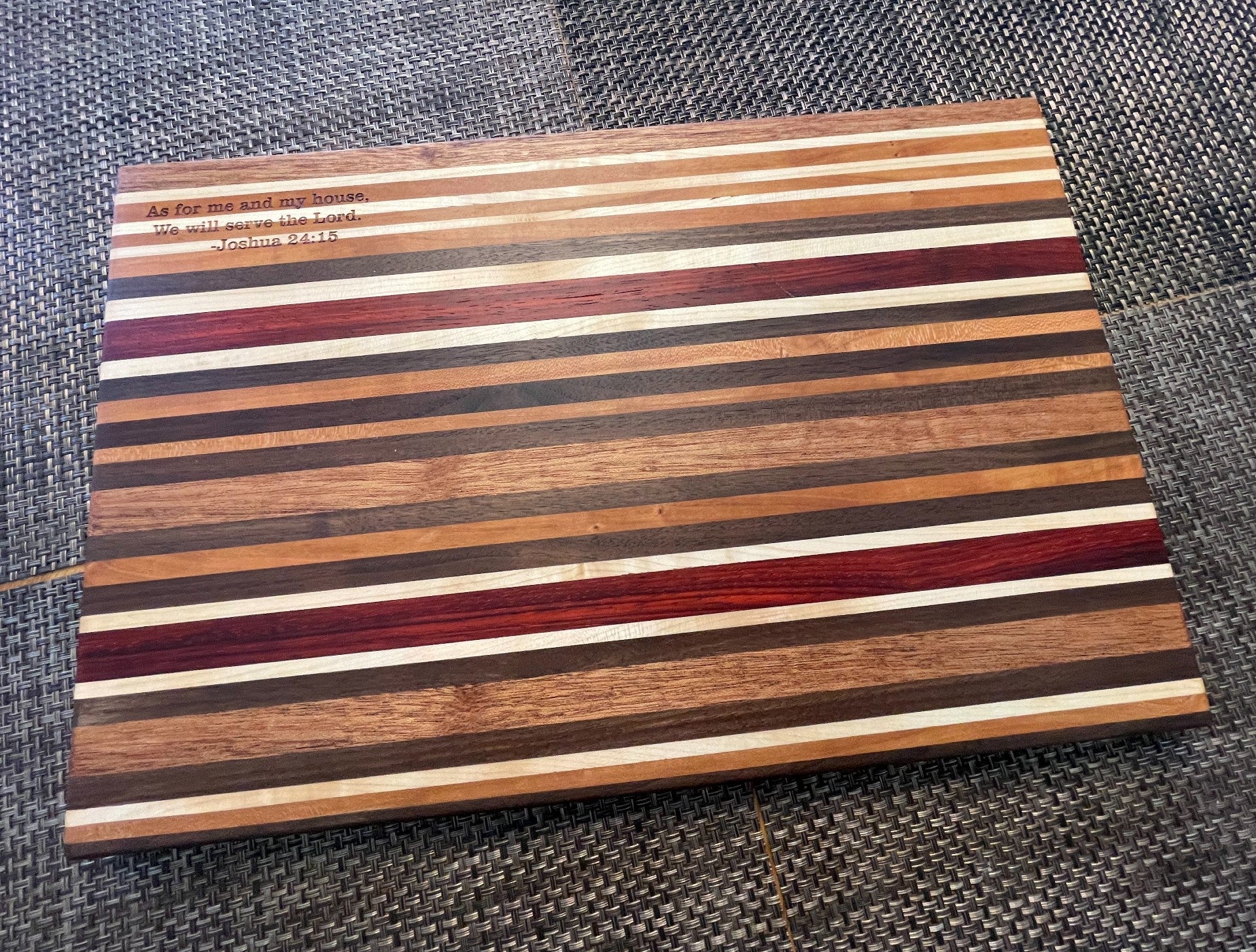 Beautiful handmade cutting board, engraved, made from both exotic and domestic hardwood.  18" x 12"